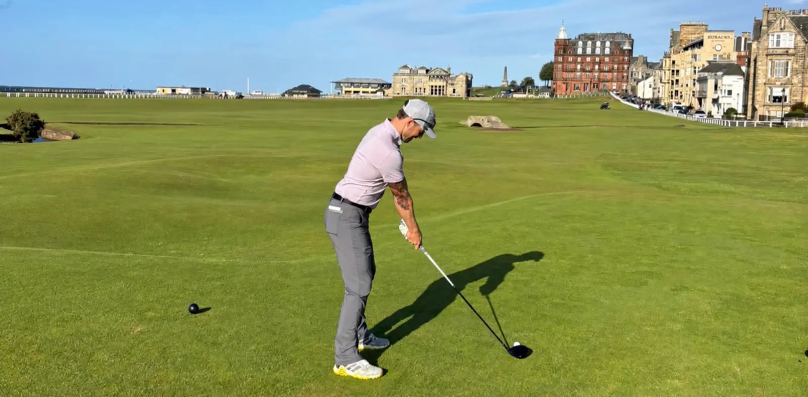 Michael Donohue preparing to hit a golf shot at St Andrews in Scotland